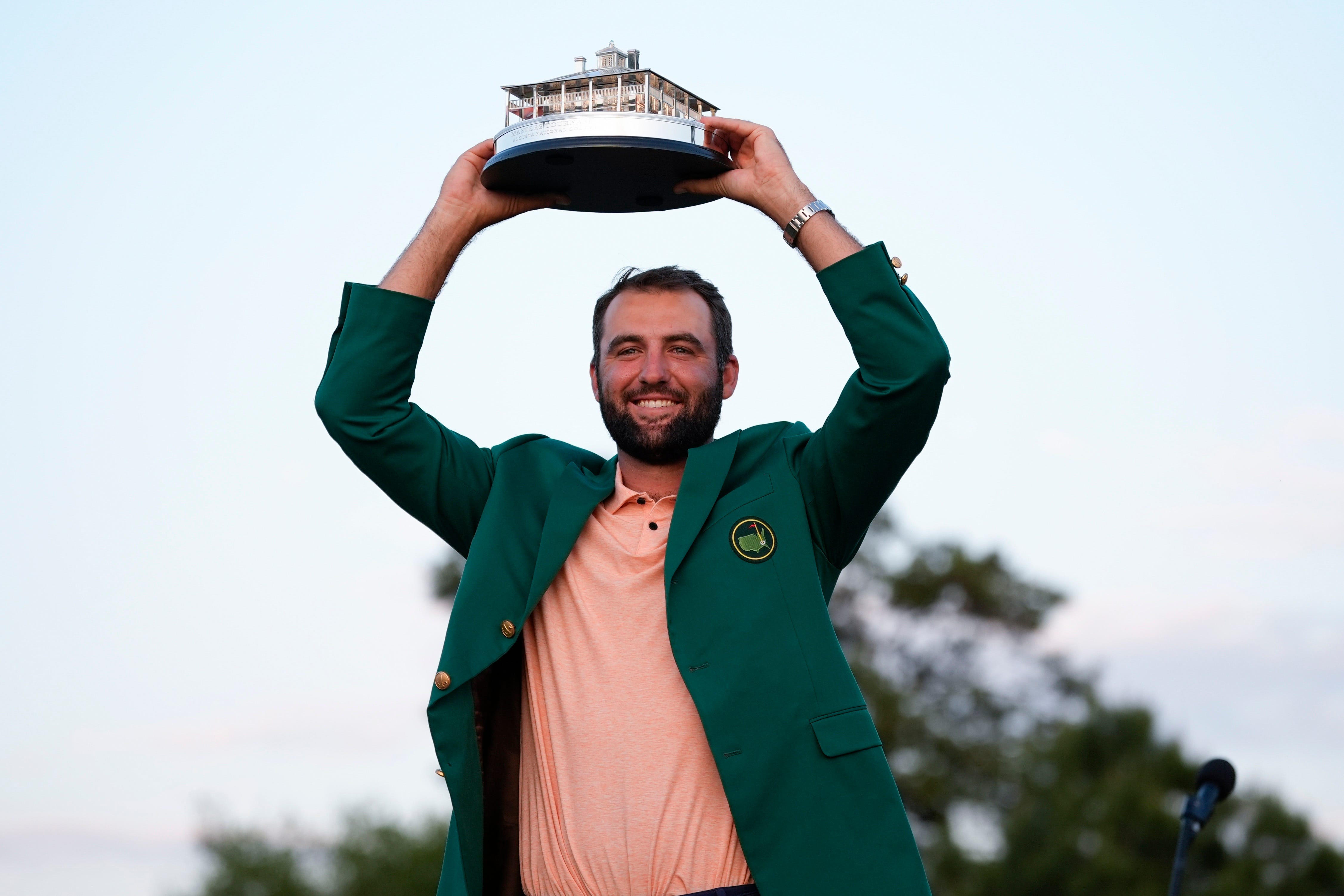 Scottie Scheffler holds the trophy after winning the Masters golf tournament at Augusta National Golf Club (Matt Slocum/AP)