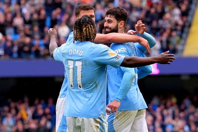 Manchester City sit atop the Premier League table (Martin Rickett/PA)