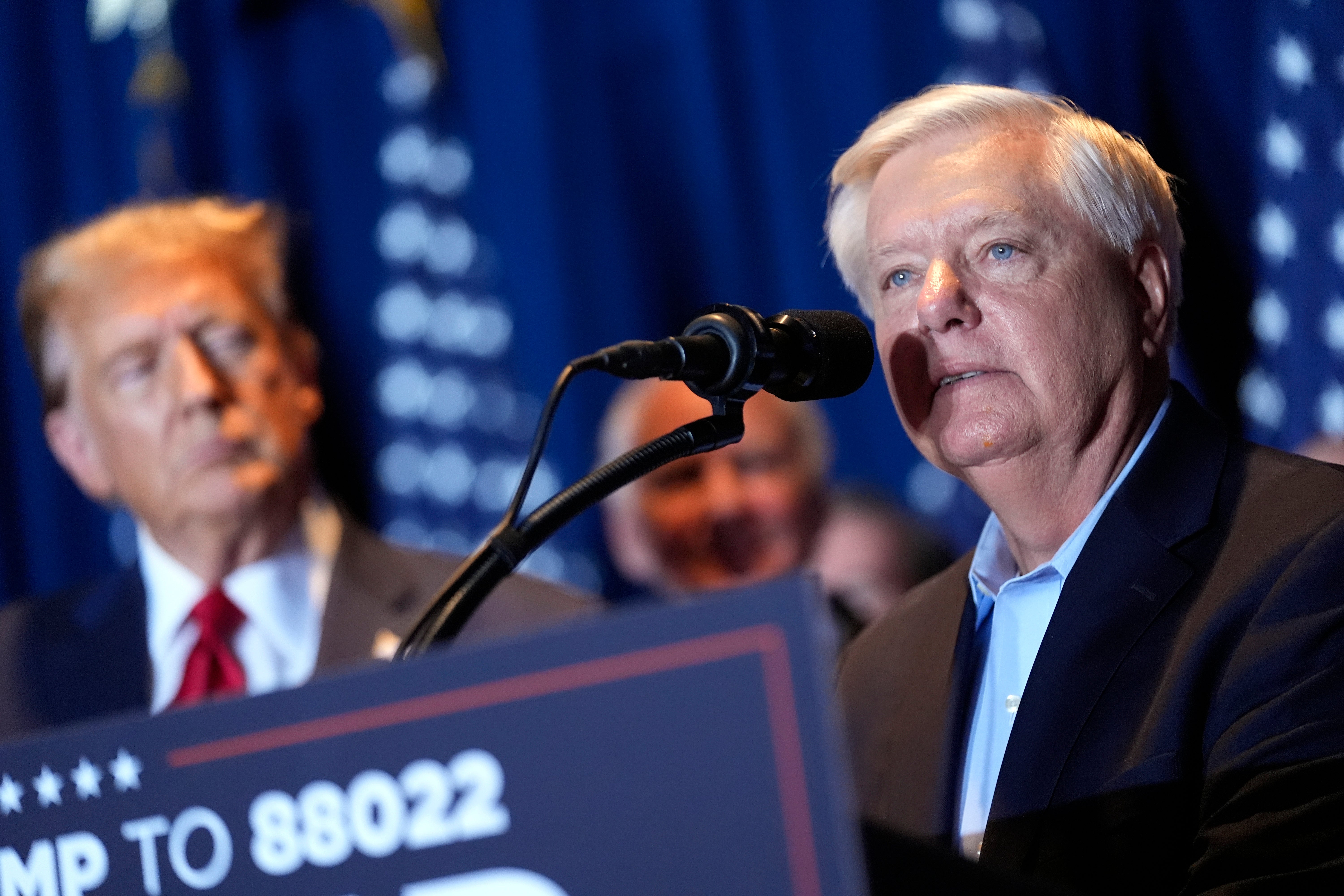 Lindsey Graham with Donald Trump at a Republican primary event in February