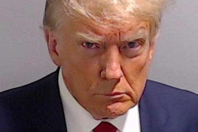 <p>Donald Trump said that he has received more support from the Black and Hispanic communities after he took his mugshot, pictured, in Fulton County, Georgia </p>