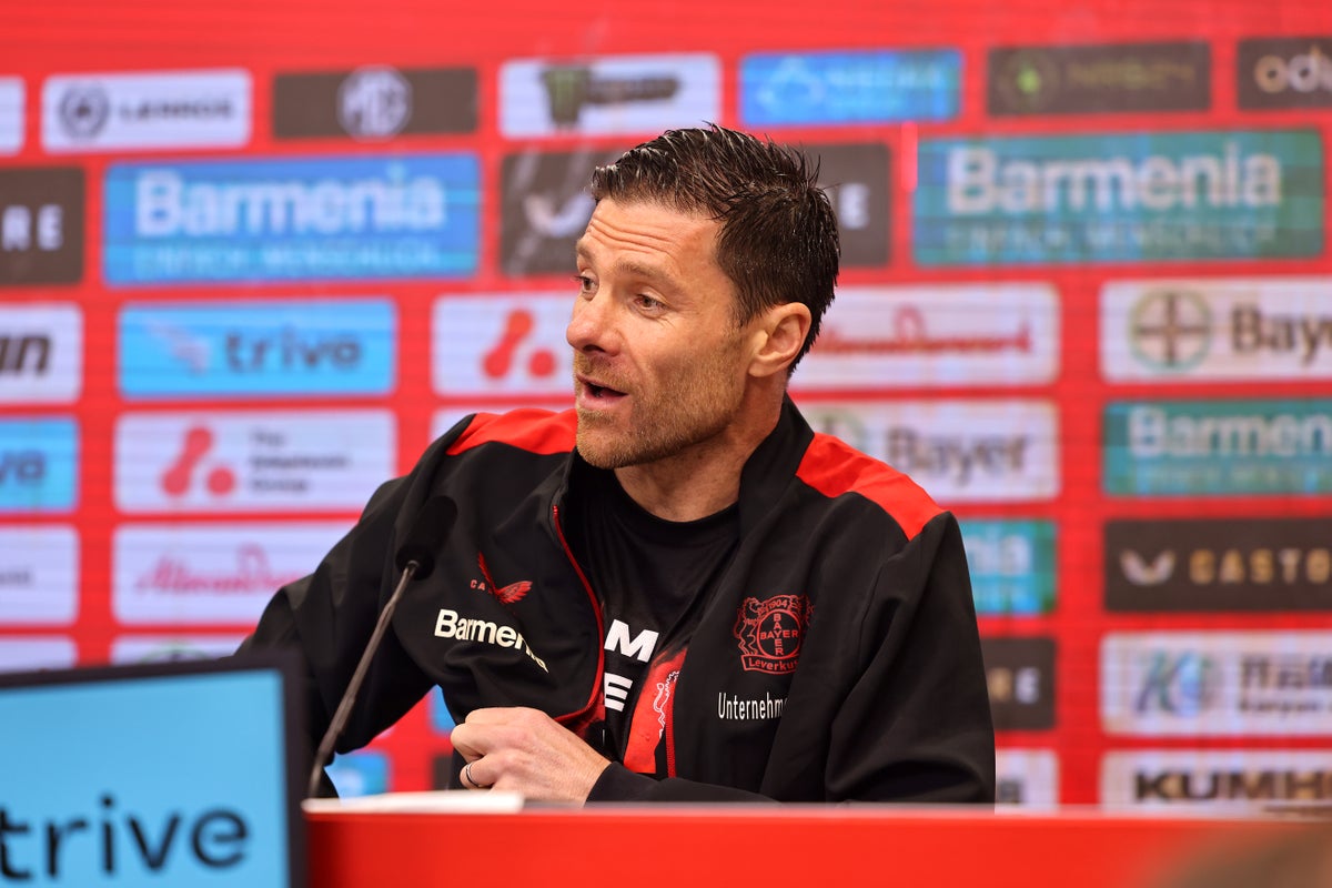 Bayer Leverkusen boss Xabi Alonso soaked in beer during press conference