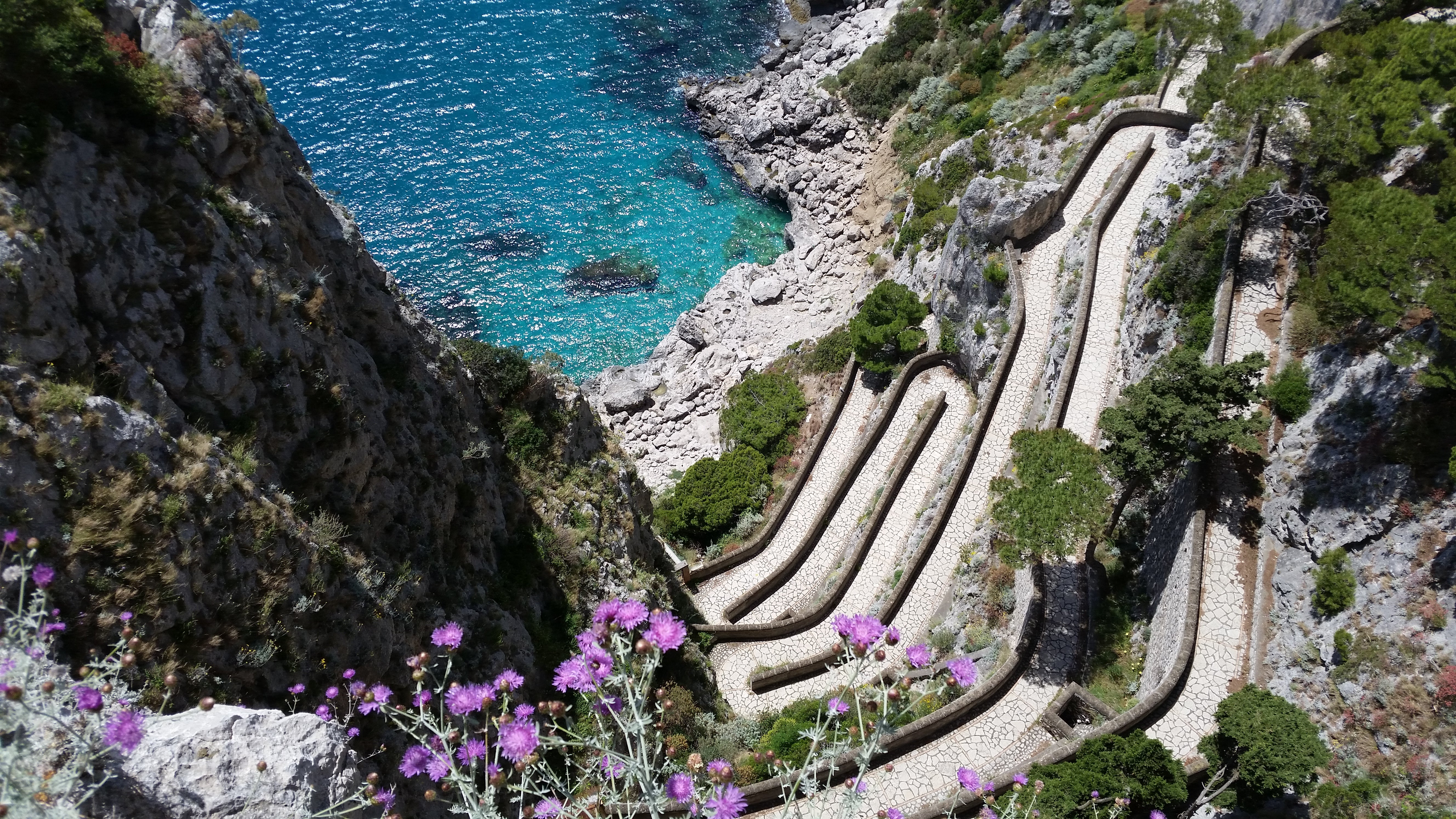 A picture shows a path to a small bay on Capri island in the Italian Gulf of Naples