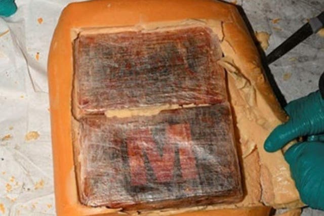 Blocks of cocaine were found inside gouda cheese following a raid in Blackburn, Lancashire (Lancashire Constabulary/PA)