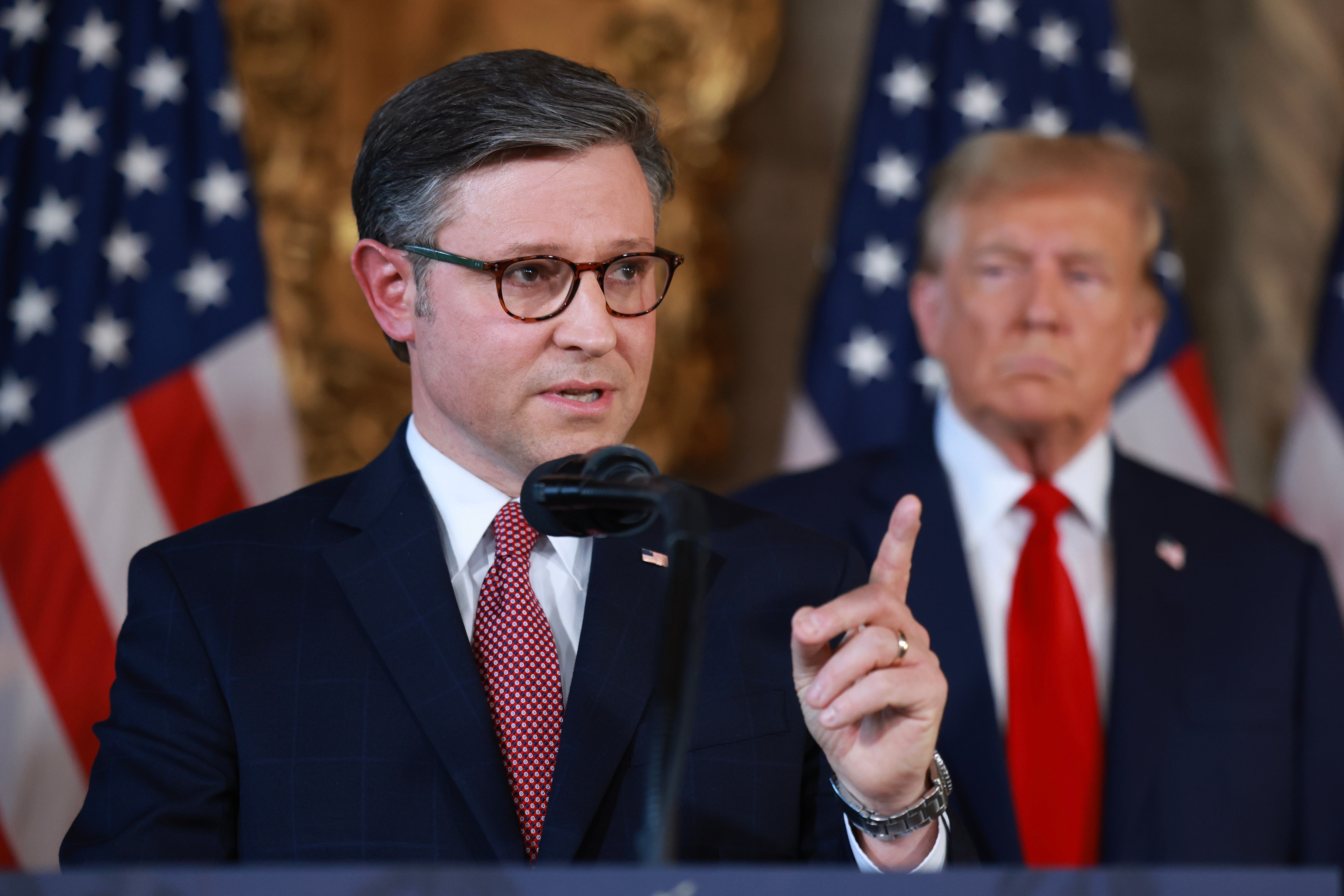 <p>Republican presidential candidate former President Donald Trump listens as Speaker of the House Mike Johnson (R-LA) speaks during a press conference at Mr. Trump's Mar-a-Lago estate on April 12, 2024, in Palm Beach, Florida</p>