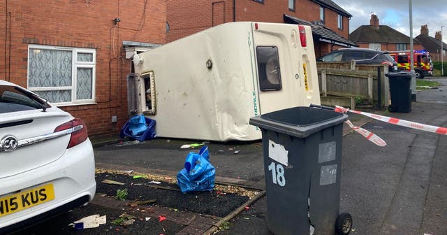 <p>The ‘tornado’ flipped a caravan on its side as the Met Office warned of severe winds across the country </p>