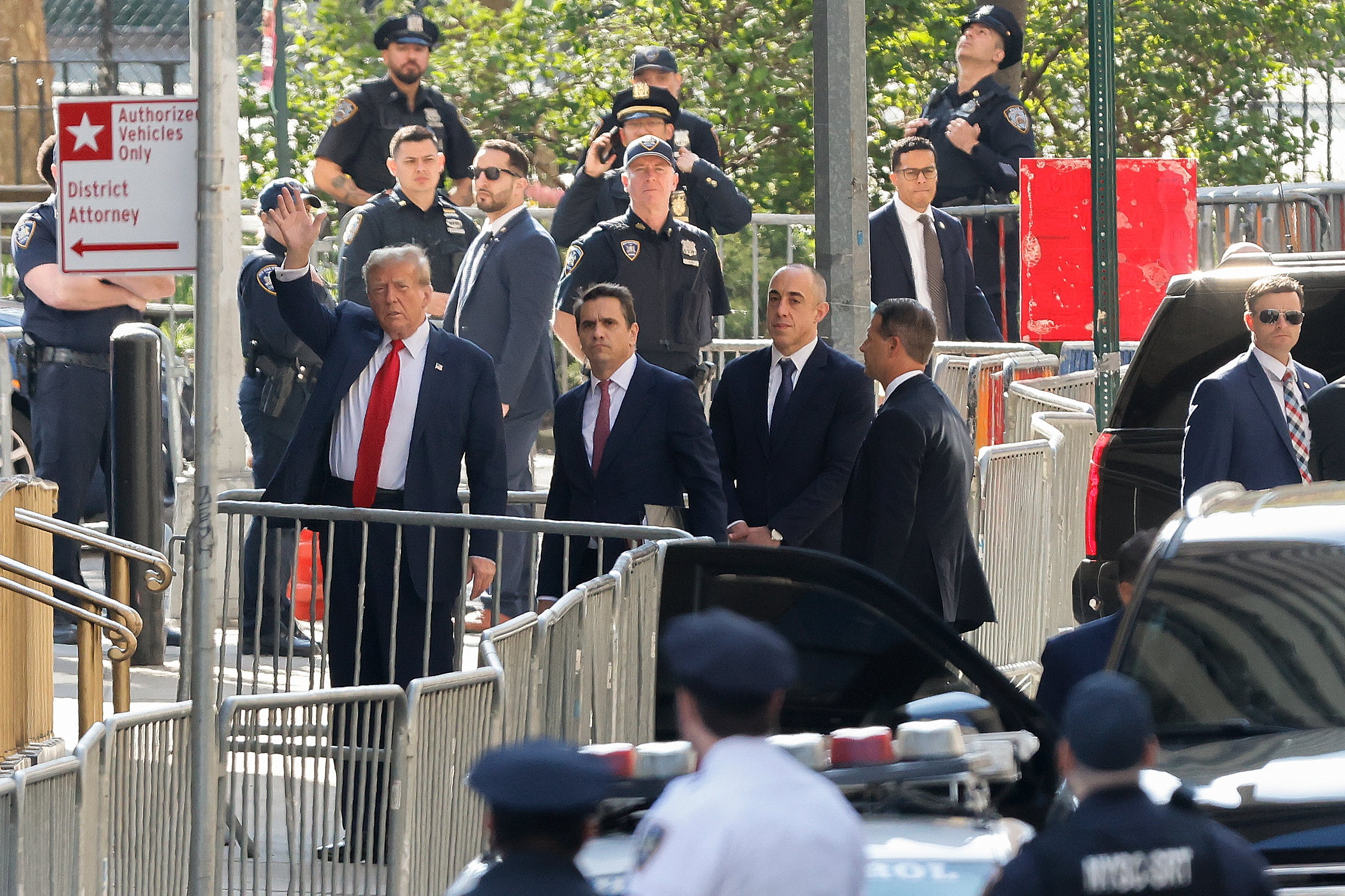 Former President Donald Trump arrives at Manhattan criminal court with his legal team on Monday, 15 April 2024