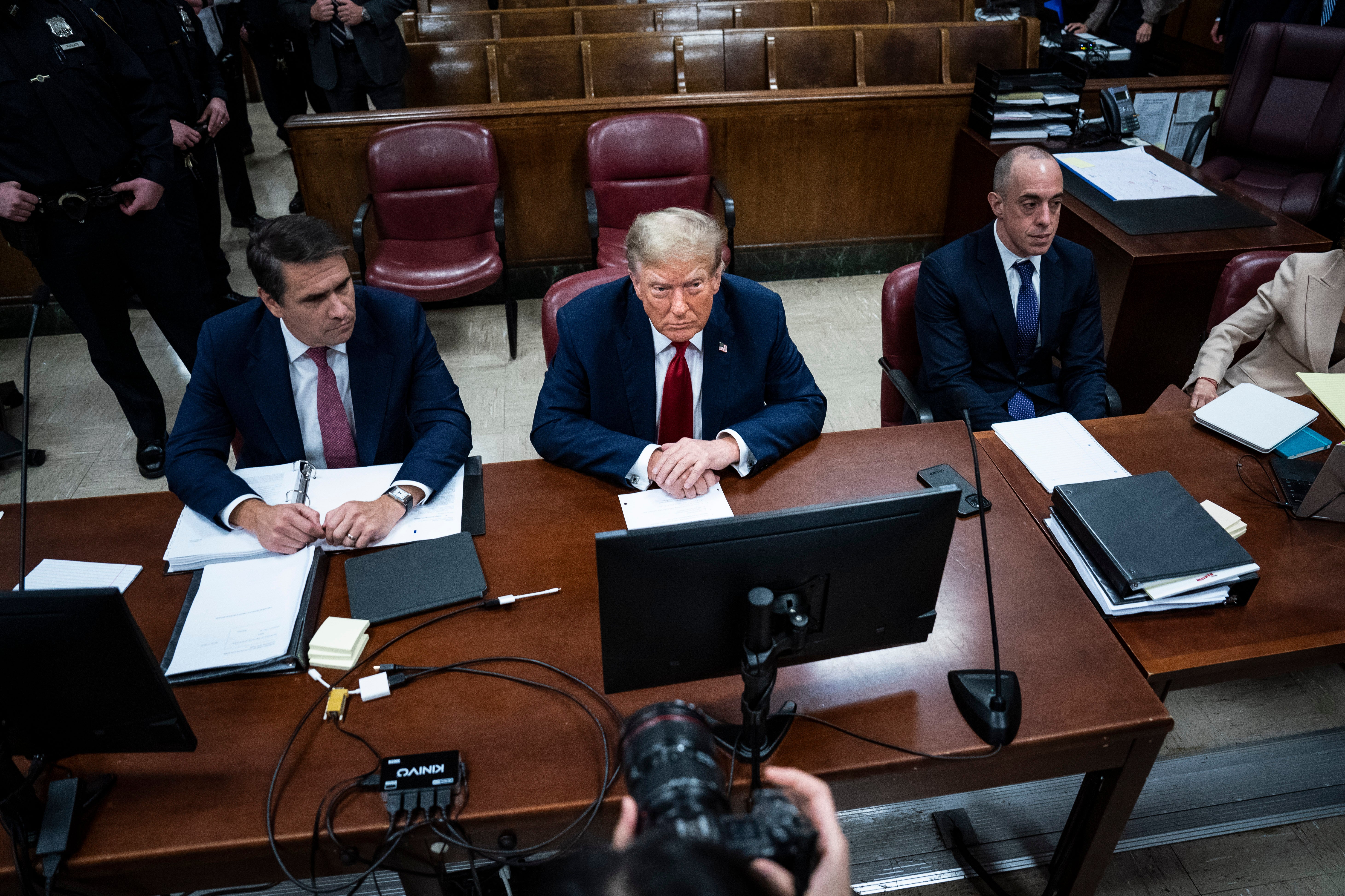 Donald Trump sits at the defence table on day one of his hush money trial