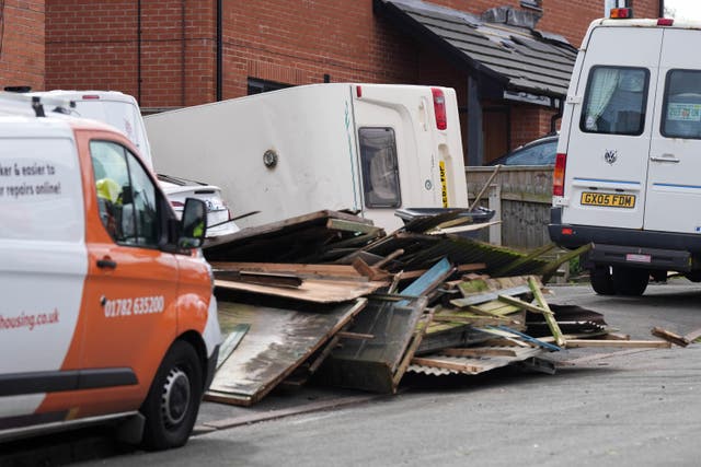 Debris and an overturned caravan on St Giles Road in Knutton, where high winds caused damage in the early hours of the morning (Jacob King/PA)