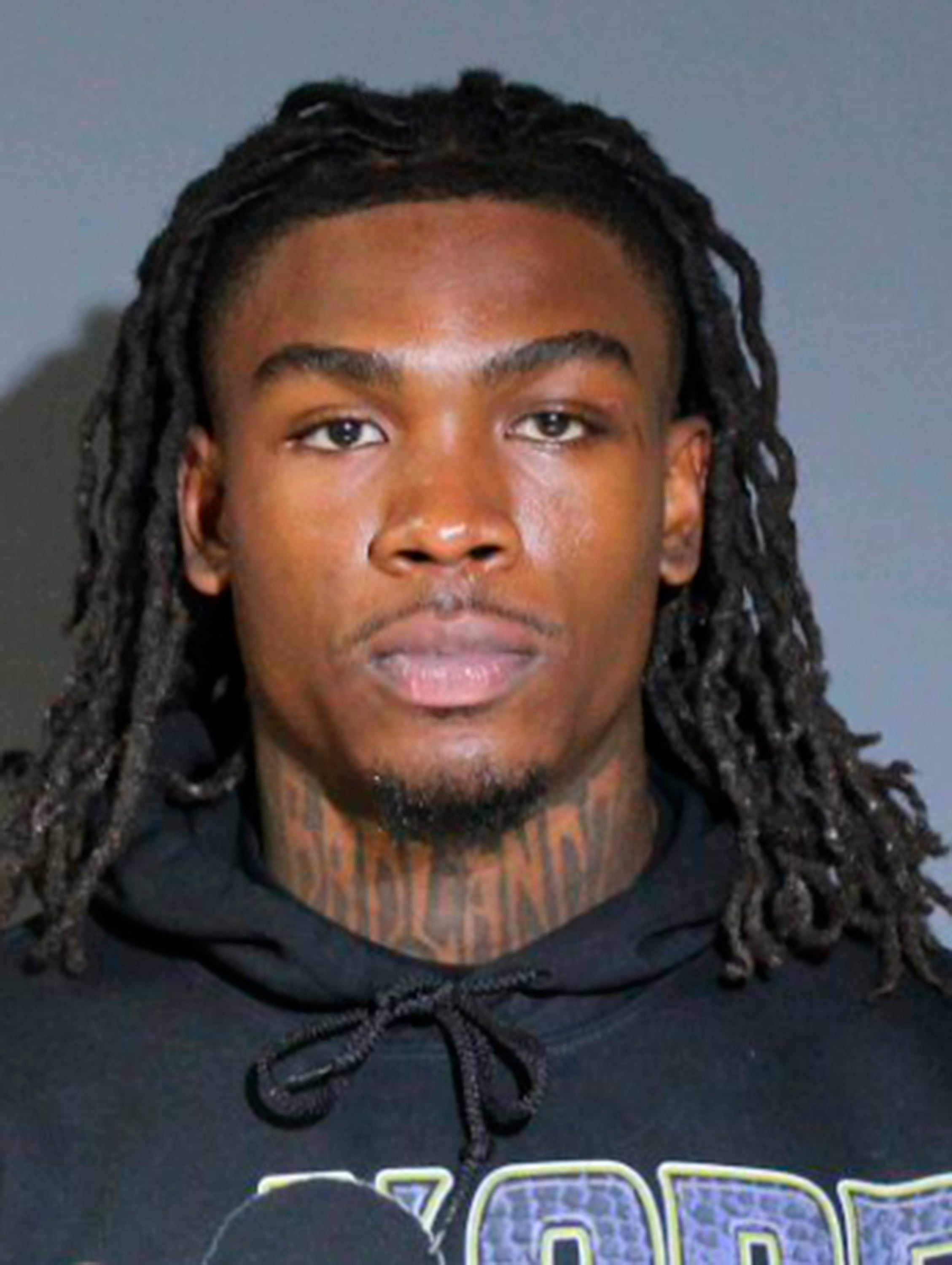 Video from KDFW showed the NFL star walking backward inside the jail, then smiling as he made a run for it out the door