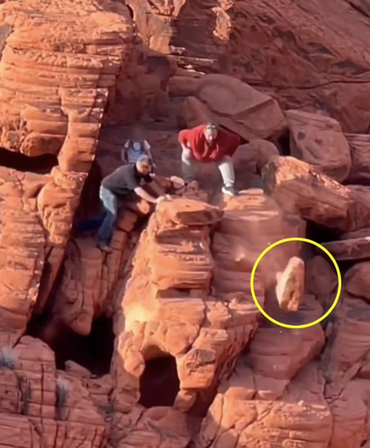 Two men were seen pushing the rocks to the ground