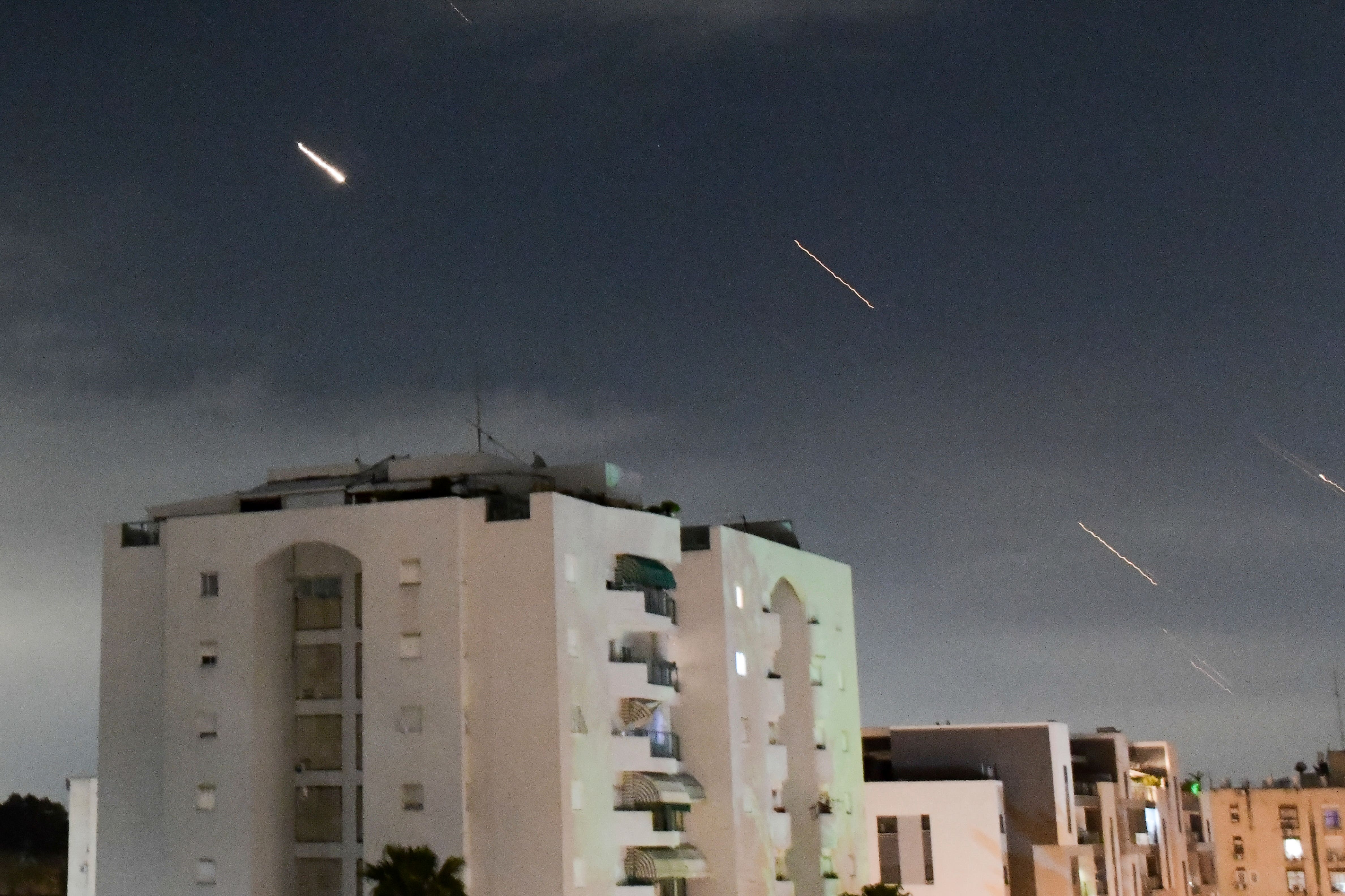 Israeli Iron Dome air defence system intercept missiles fired from Iran on central Israel on Saturday night