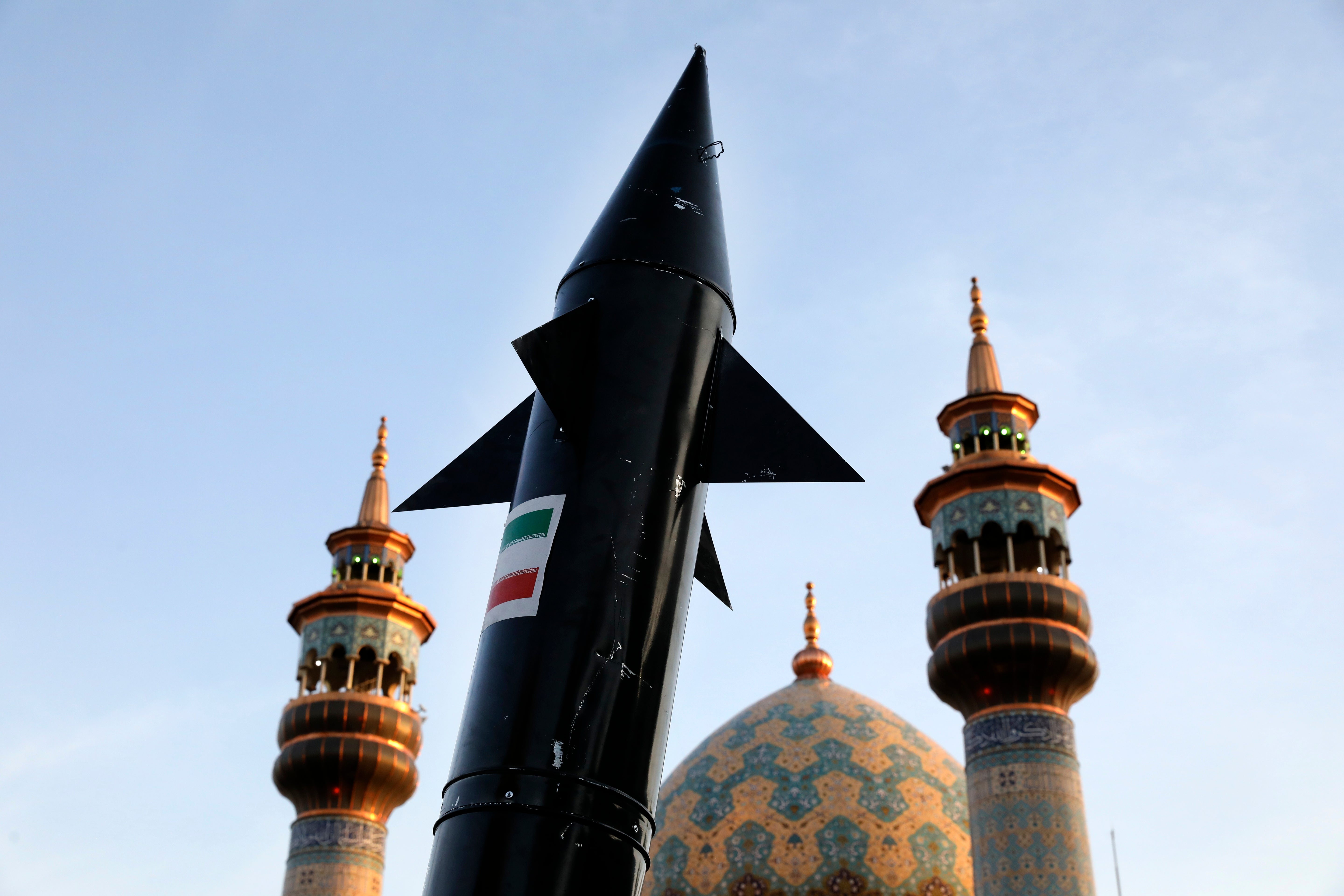 A model of a missile is carried by Iranian demonstrators outside a mosque in Tehran