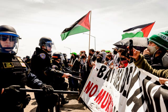 <p>Demonstrators block Interstate 880 in Oakland, California, on 15 April, 2024, part of a series of protests that also saw activists take over the Golden Gate Bridge. </p>