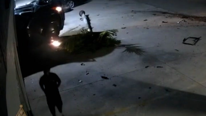 <p>Driver jogs away after flipping car multiple times and crashing into garage.</p>