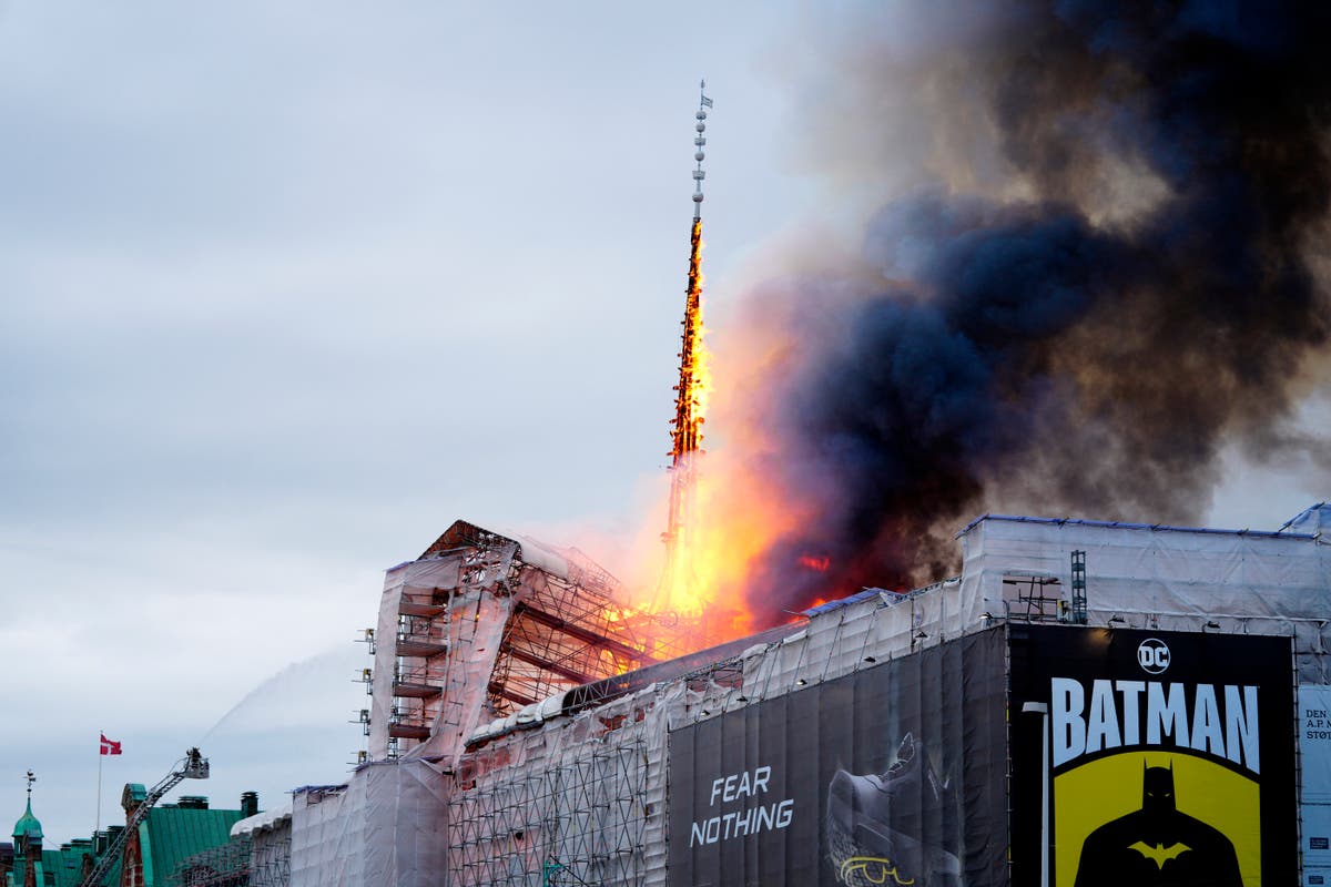 Copenhagen stock exchange fire sees iconic spire collapse in huge inferno