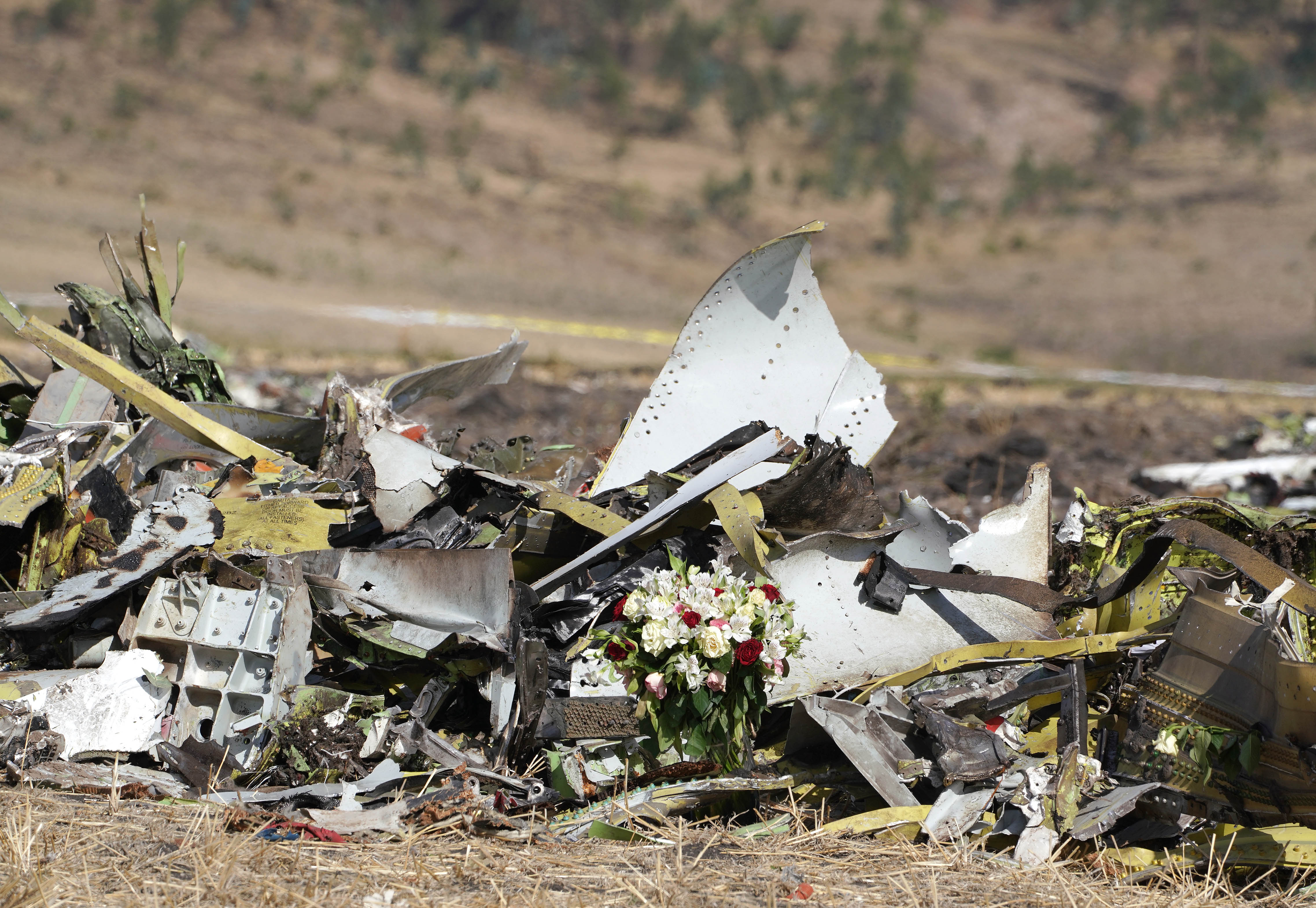 A bouquet of flowers is left at the site of the Ethiopian Airlines Boeing 737 Max crash