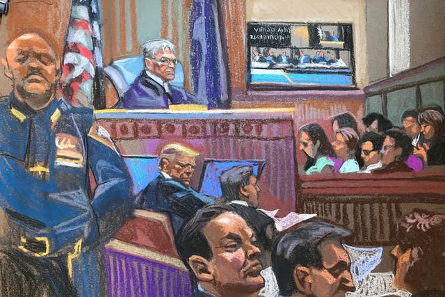 <p>Former US president Donald Trump sits beside his lawyer Todd Blanche on the second day of jury selection in his criminal trial in Manhattan Criminal Court in New York City</p>