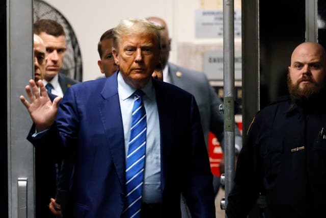 <p>Former President Donald Trump returns to the courtroom after a break during the second day of his criminal trial at Manhattan Criminal Court on April 16, 2024 in New York City</p>