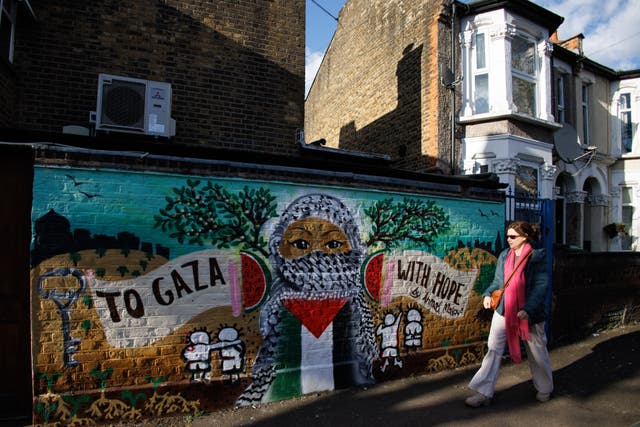 <p>Representational:  A person walks past a mural painted in solidarity with the people of Palestine, in east London, Britain</p>