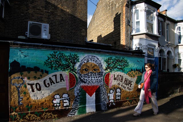<p>Representational:  A person walks past a mural painted in solidarity with the people of Palestine, in east London, Britain</p>