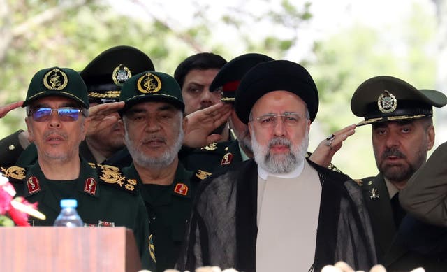 <p>File: Iranian President Ebrahim Raisi (3-L) flanked by Iranian IRGC and Army generals arrives during the annual Army Day at a military base in Tehran </p>