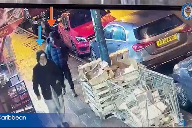 <p>Mohammed Abbkr (red arrow) following Mohammed Rayaz (blue arrow), 70 after leaving a prayer service at the Dudley Road Mosque</p>