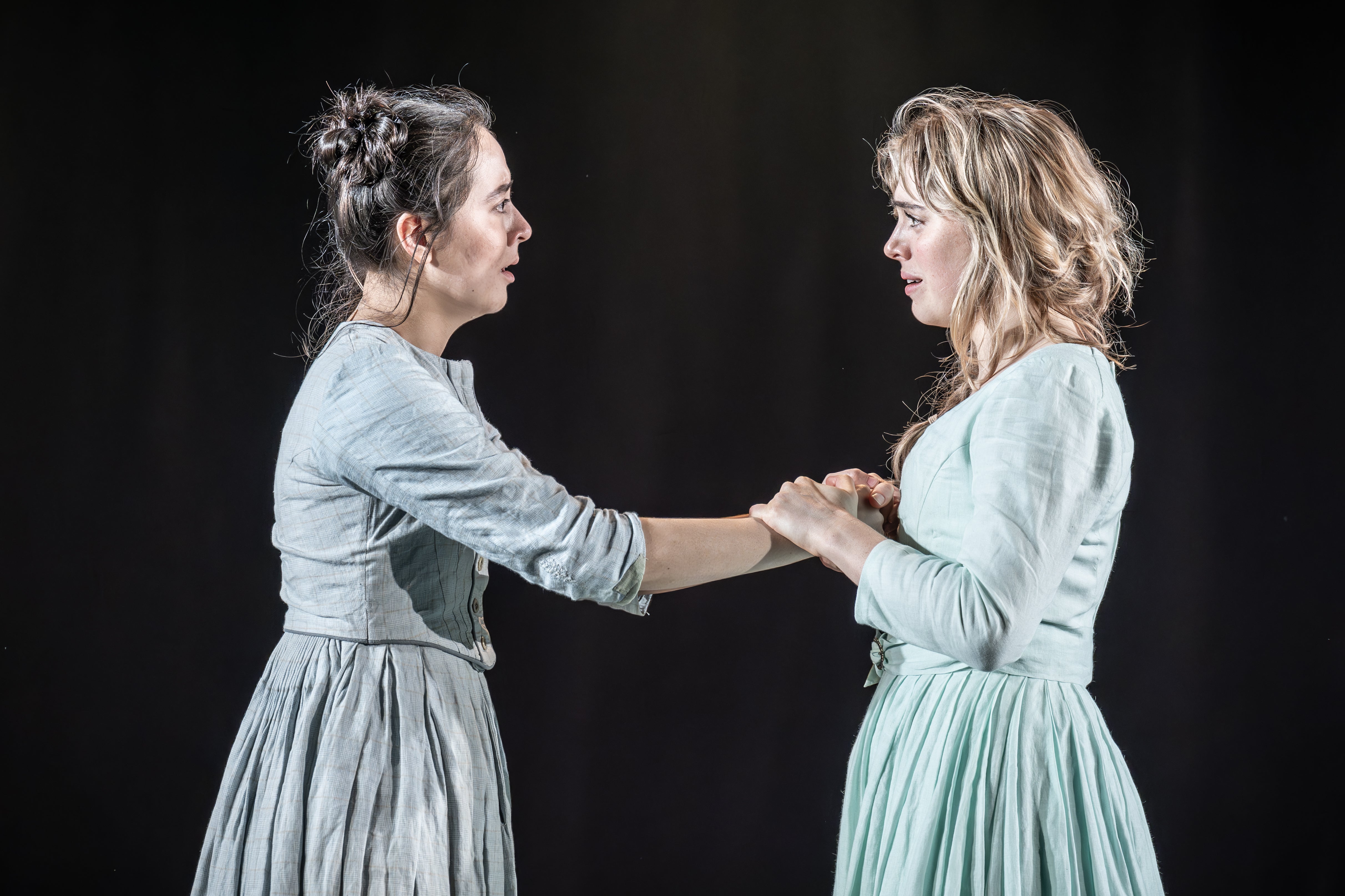 Ami Tredrea (Lizzie Hexam) and Bella Maclean (Bella Wilfer) in ‘London Tide’ at the National Theatre