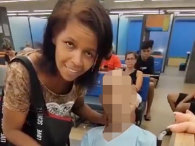 <p>Eika de Souza Vieira Nunes, left, at a bank in Brazil where she attempted to use the corpse of a man she claimed to be her uncle to cosign a bank loan</p>