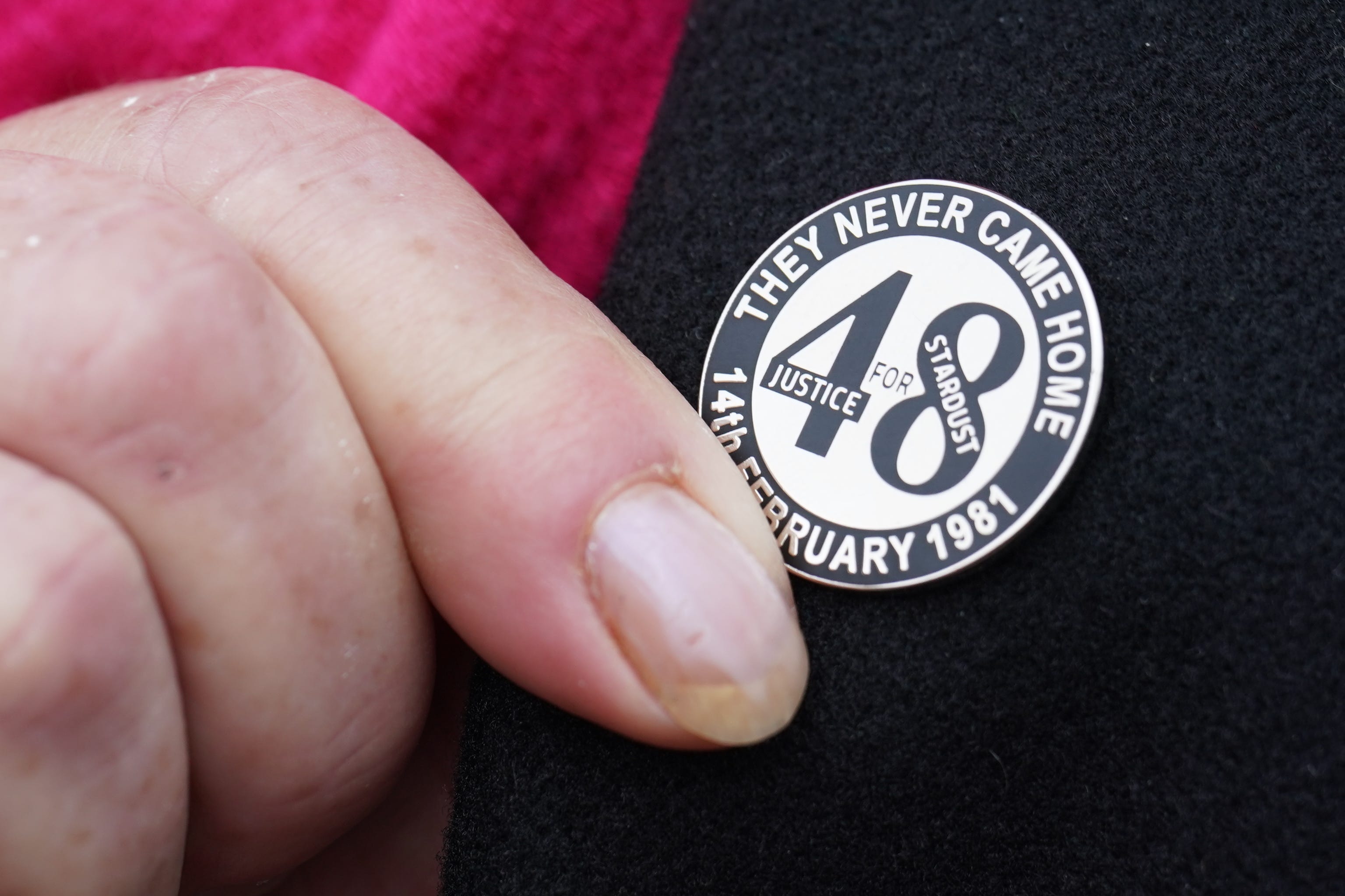Lapel pins remember those who died