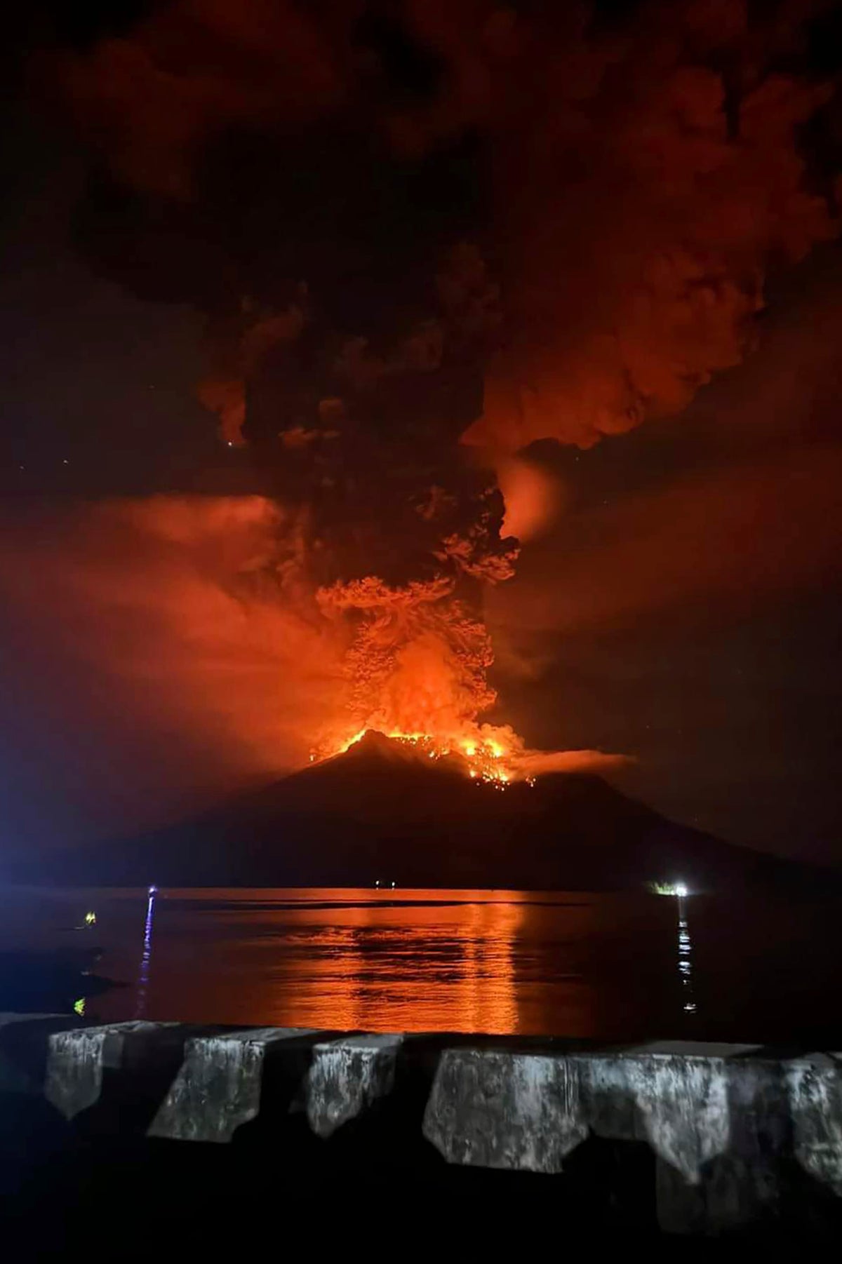 Tsunami alert after a volcano in Indonesia has several big eruptions and thousands are told to leave