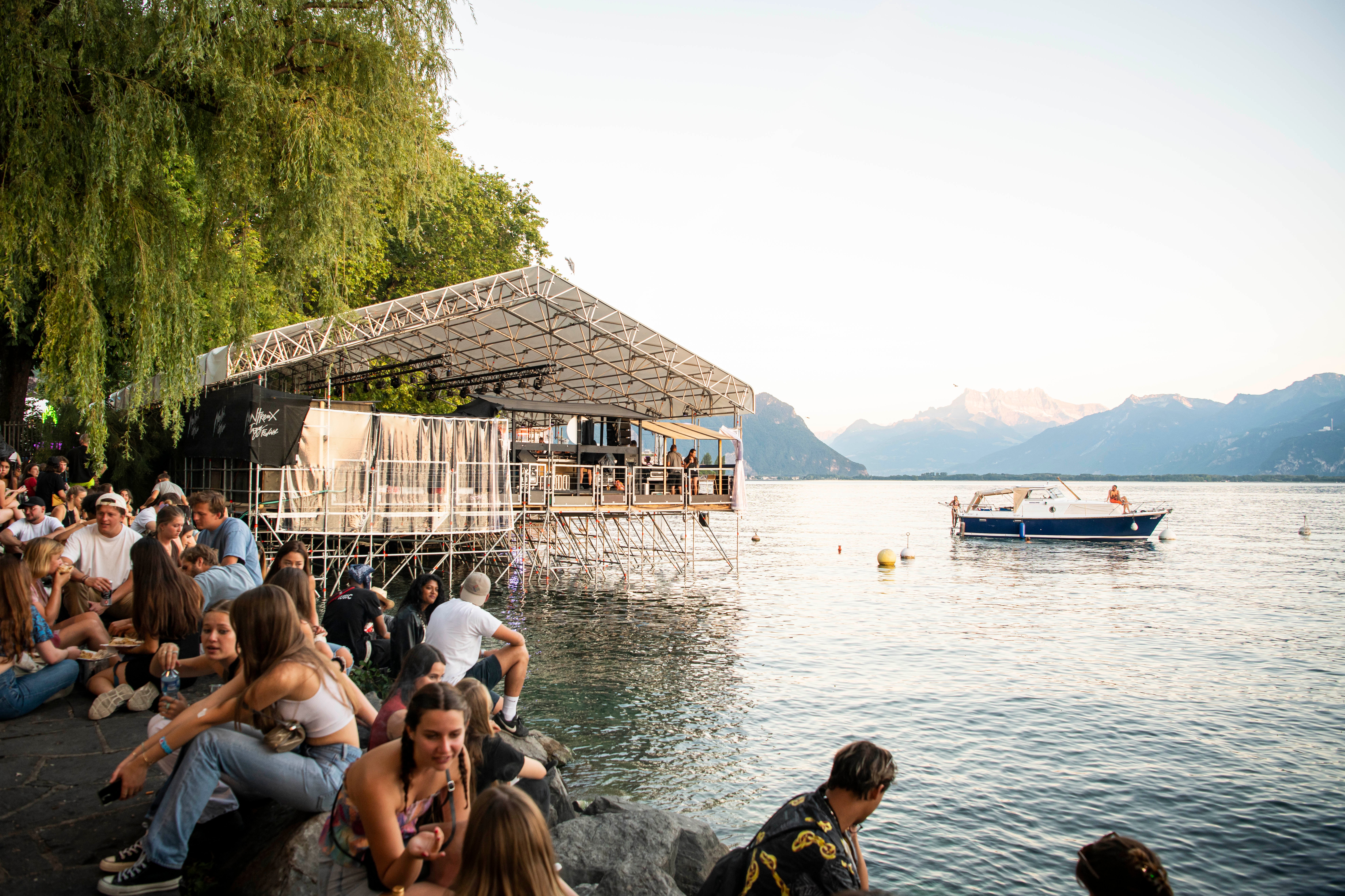 Fans watch bands perform by Lake Geneva at Montreux Jazz Festival