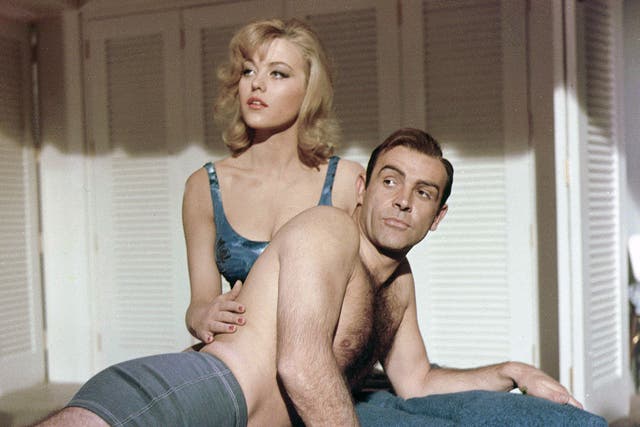 <p>No country for gold men: Margaret Nolan and Sean Connery in ‘Goldfinger’</p>