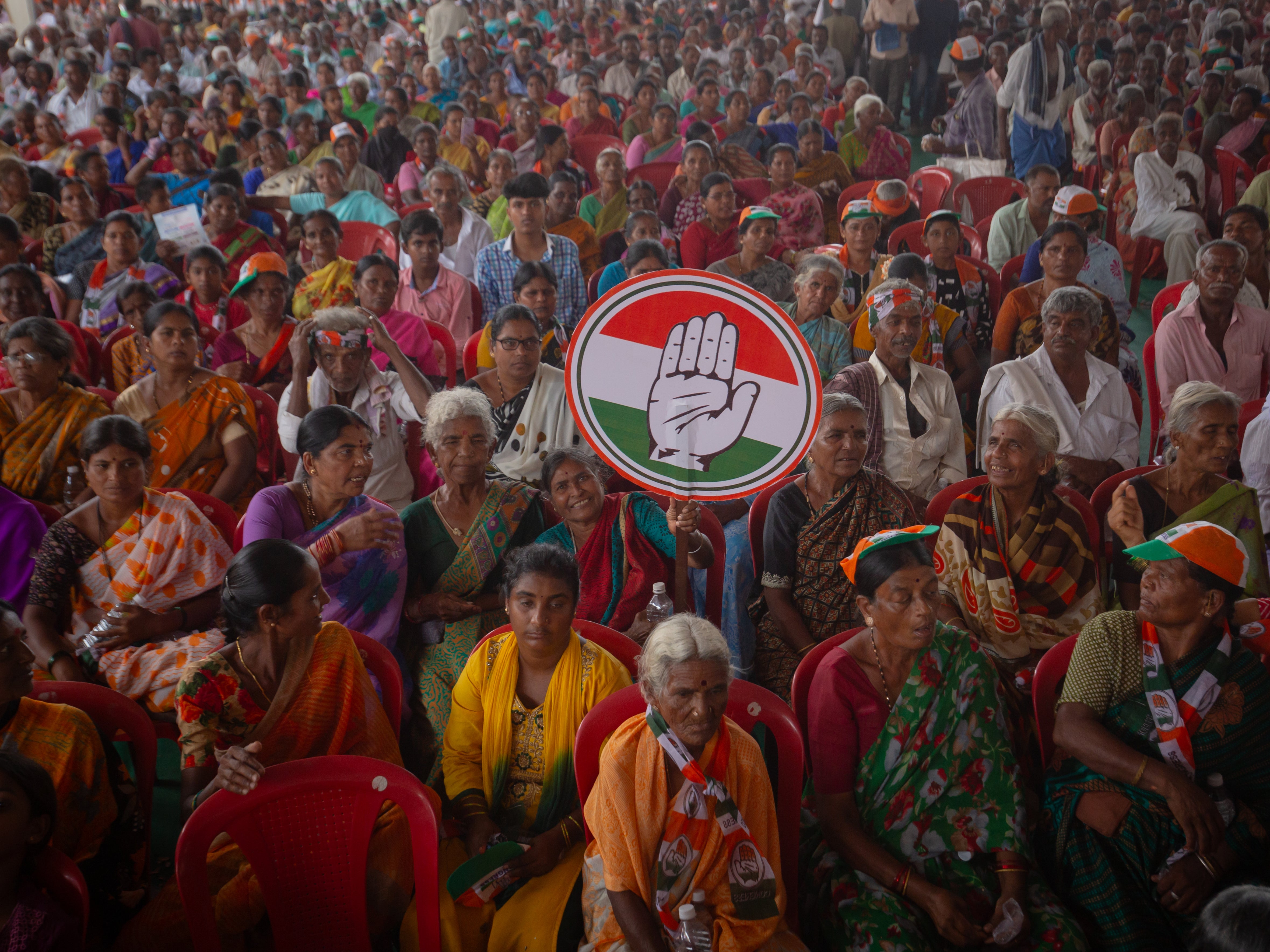 Supporters of the opposition Congress party attend an election rally addressed by party leader Rahul Gandhi in Mandya, on 17 April 2024