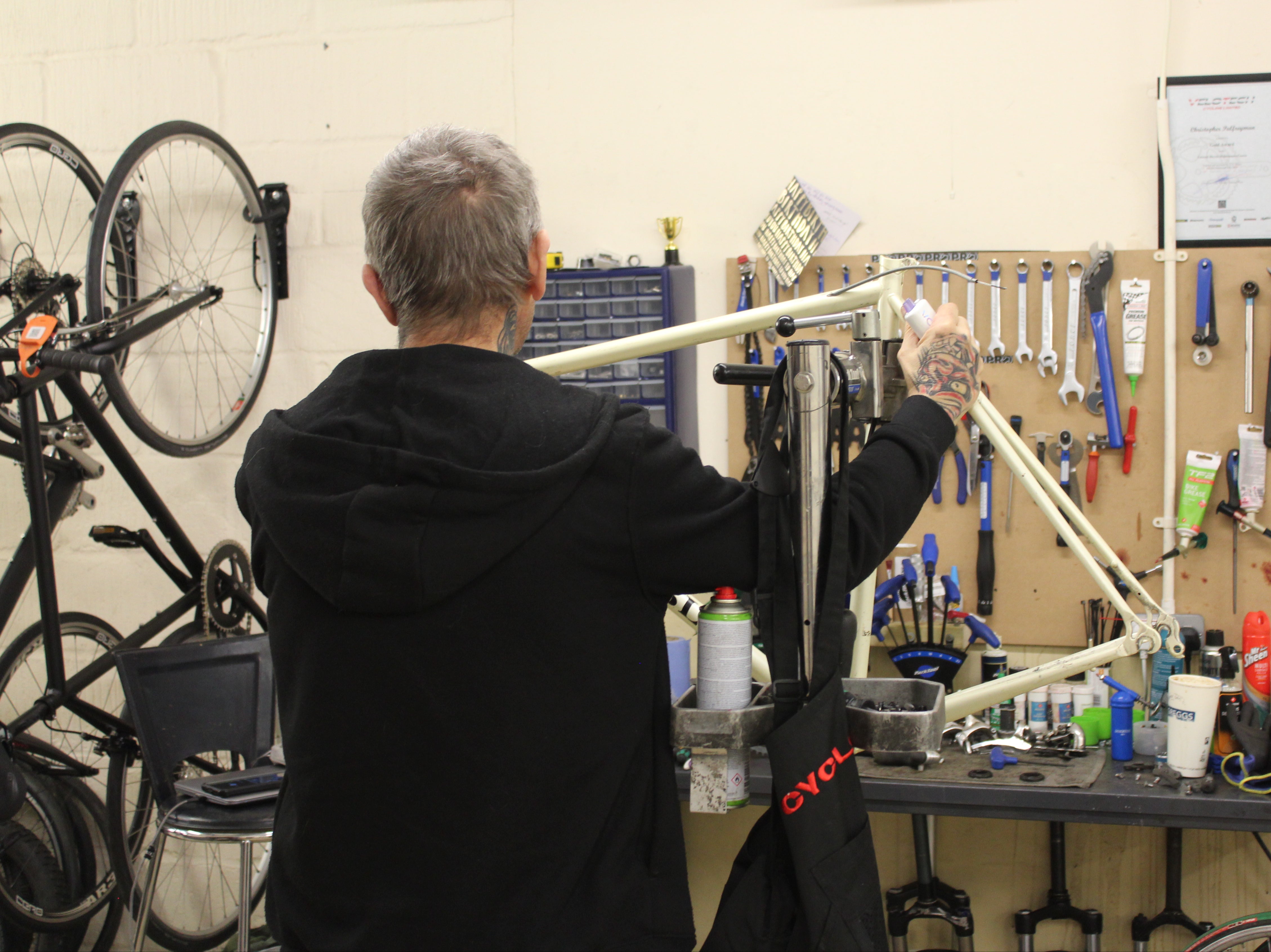 Chris works on custom frame in the workshop above XO Bikes’ Lewisham flagship store