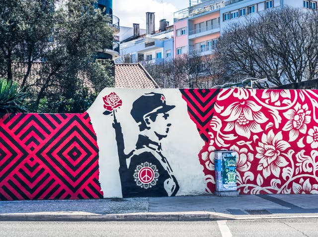 <p>Flower power: a mural in the city commemorates the 1974 revolution </p>