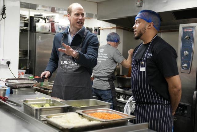 The Prince of Wales helped make bolognaise sauce during a visit to Surplus to Supper (Alastair Grant/PA)