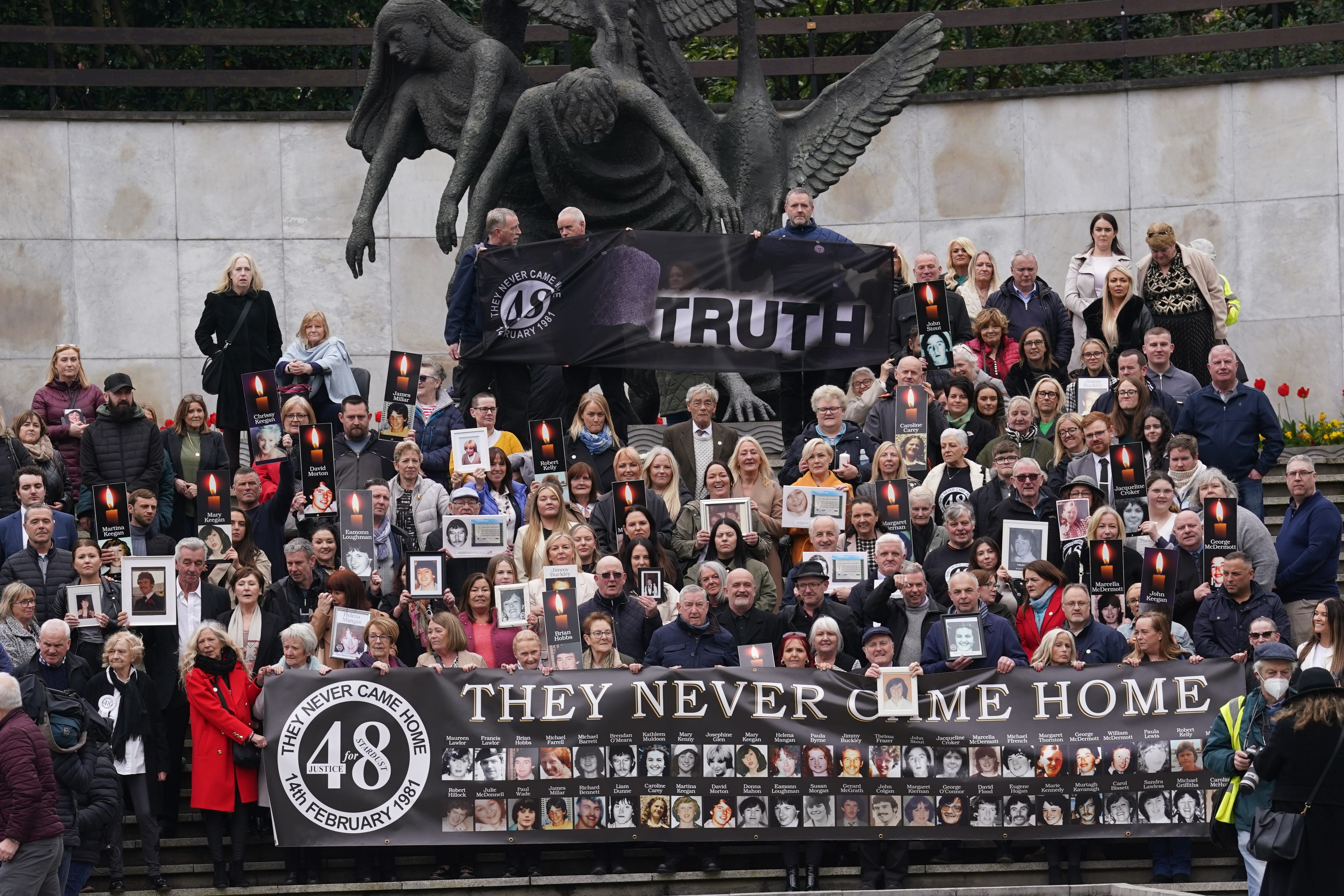 Survivors and family members in the Garden of Remembrance in Dublin after a verdict of unlawful killing has been returned by the jury in the Stardust fire inquests for all 48 people who died (PA)