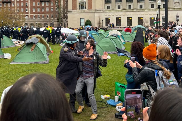 <p>New York Police officers arrest a protestor who participated in an encampment on the Columbia University campus, Thursday, April 18, 2024, in New York</p>