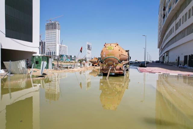 <p>A truck drains flood water following heavy rainfall in Dubai</p>