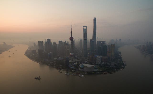 <p>A general view shows the financial district of Lujiazui in Shanghai early on June 23, 2016</p>