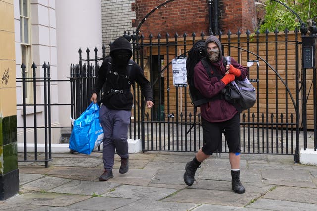 <p>Squatters leaving the York & Albany pub near Regent’s Park (Lucy North/PA)</p>