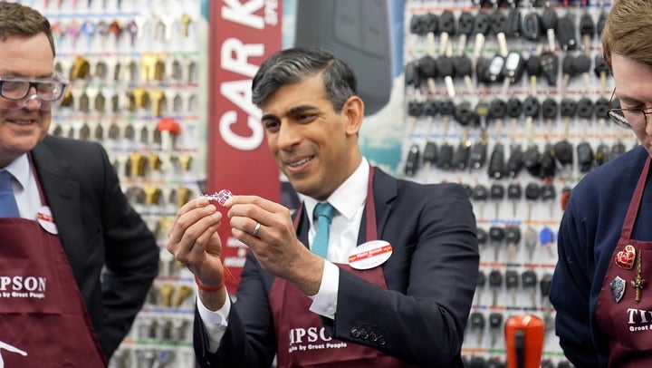 <p>Rishi Sunak dons red apron and gets to work cutting keys on Timpsons visit as he pledges to end ‘sick note culture’.</p>