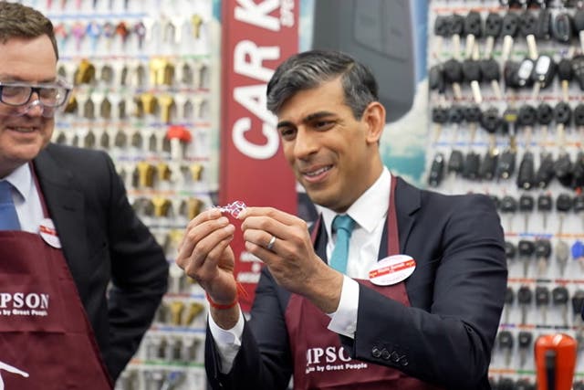 <p>Rishi Sunak dons red apron and gets to work cutting keys on Timpsons visit as he pledges to end ‘sick note culture’.</p>