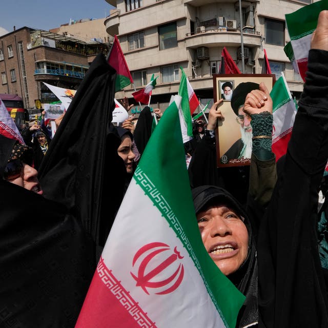 <p>Iranians protest in Tehran after Israel’s ‘limited’ attack on a strategically important military air base in Isfahan</p>