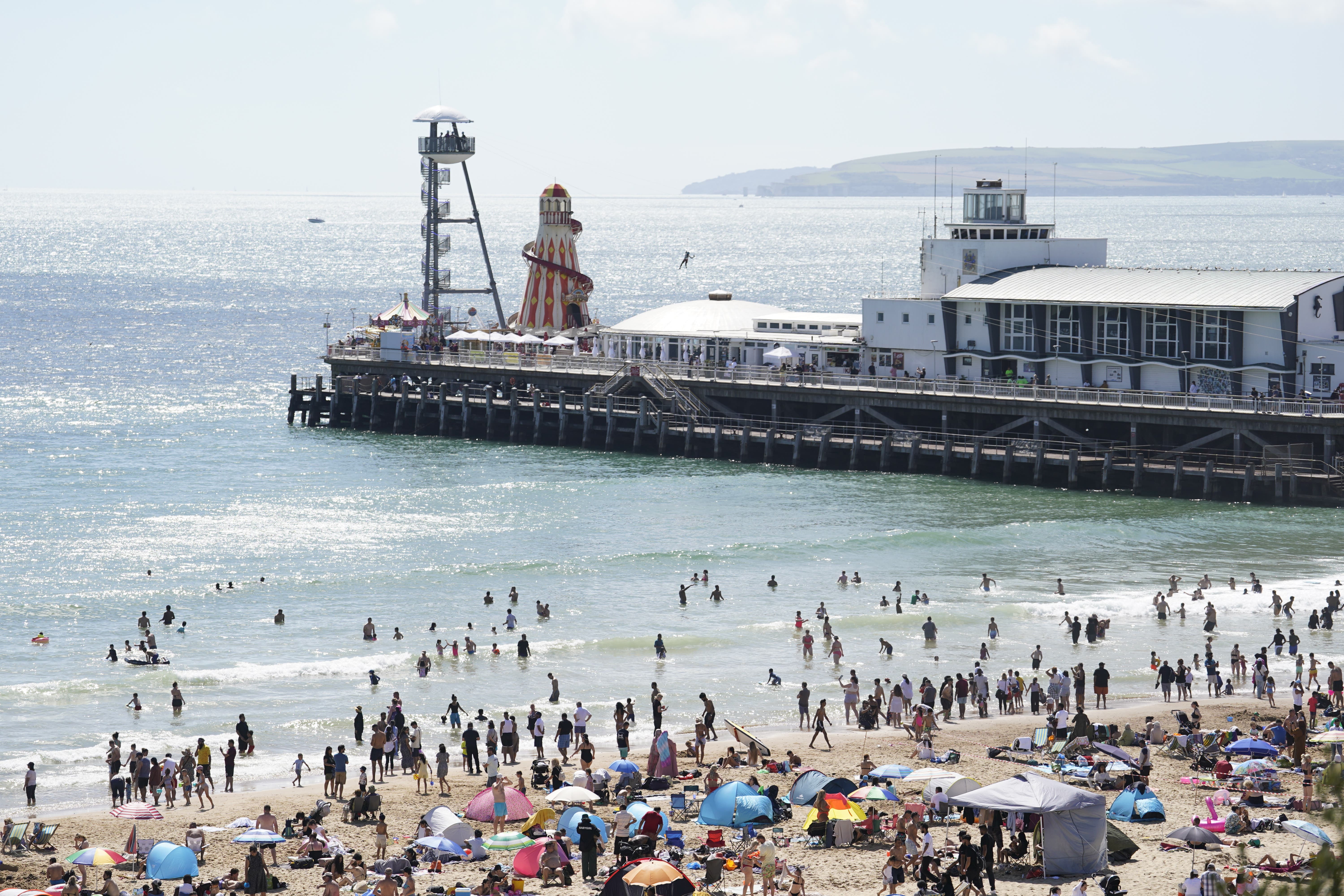 People enjoying the weather on Bournemouth beach (PA)