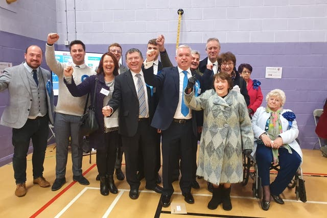 <p>Katie Fieldhouse (top right with pink jacket) looks unimpressed as Mark Menzies celebrates his emphatic election victory in 2019 </p>
