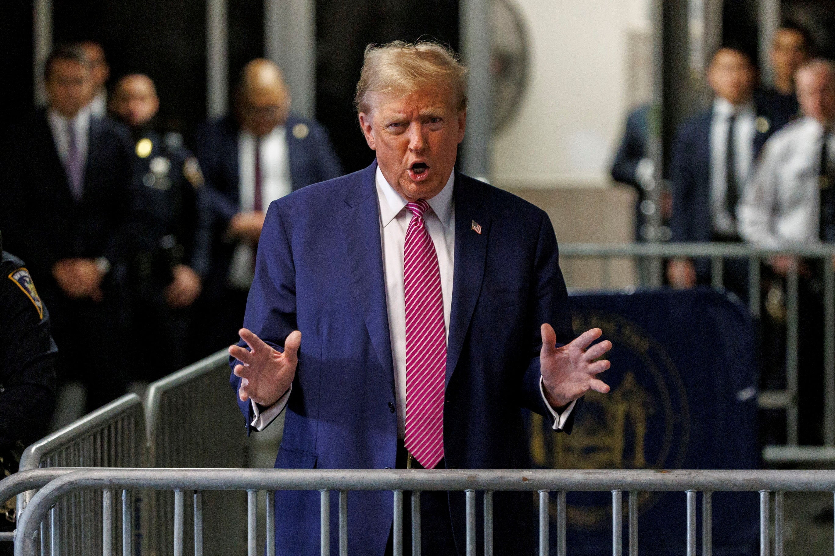 Donald Trump speaks to the press before court on 19 April