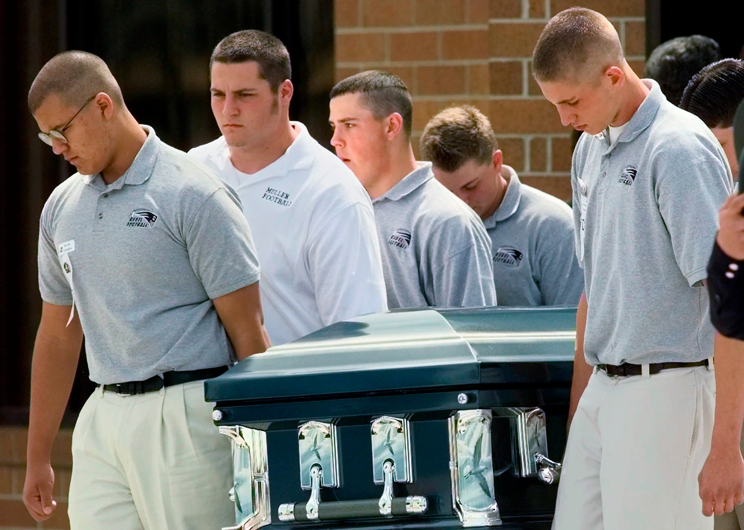 Pallbearers carry the casket of Columbine High School student, Matthew Kechter, out of St. Frances Cabrini Catholic Church in Littleton, one week after the 1999 shooting