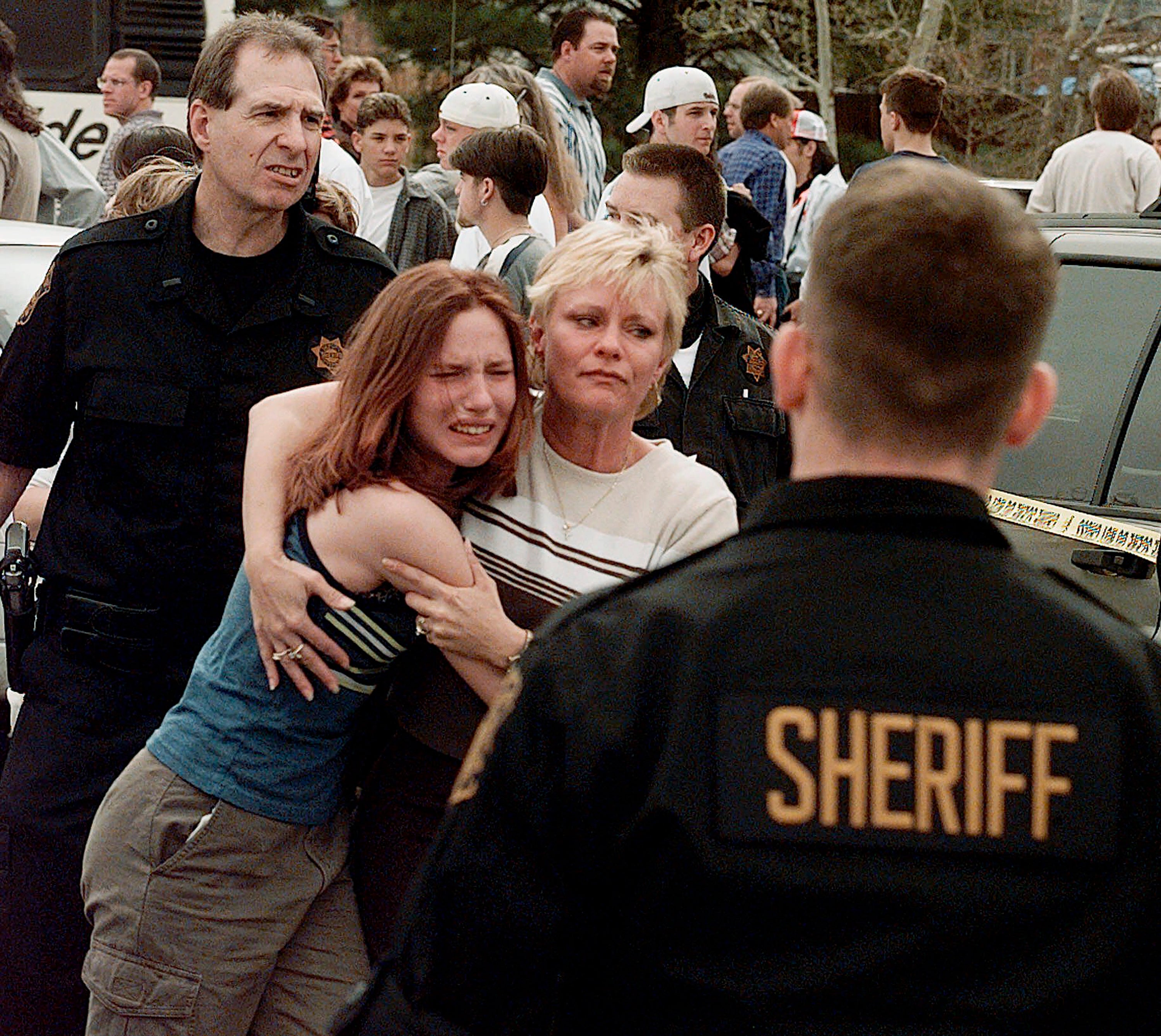 A woman embraces her daughter after they were reunited following the Columbine shooting in April 1999