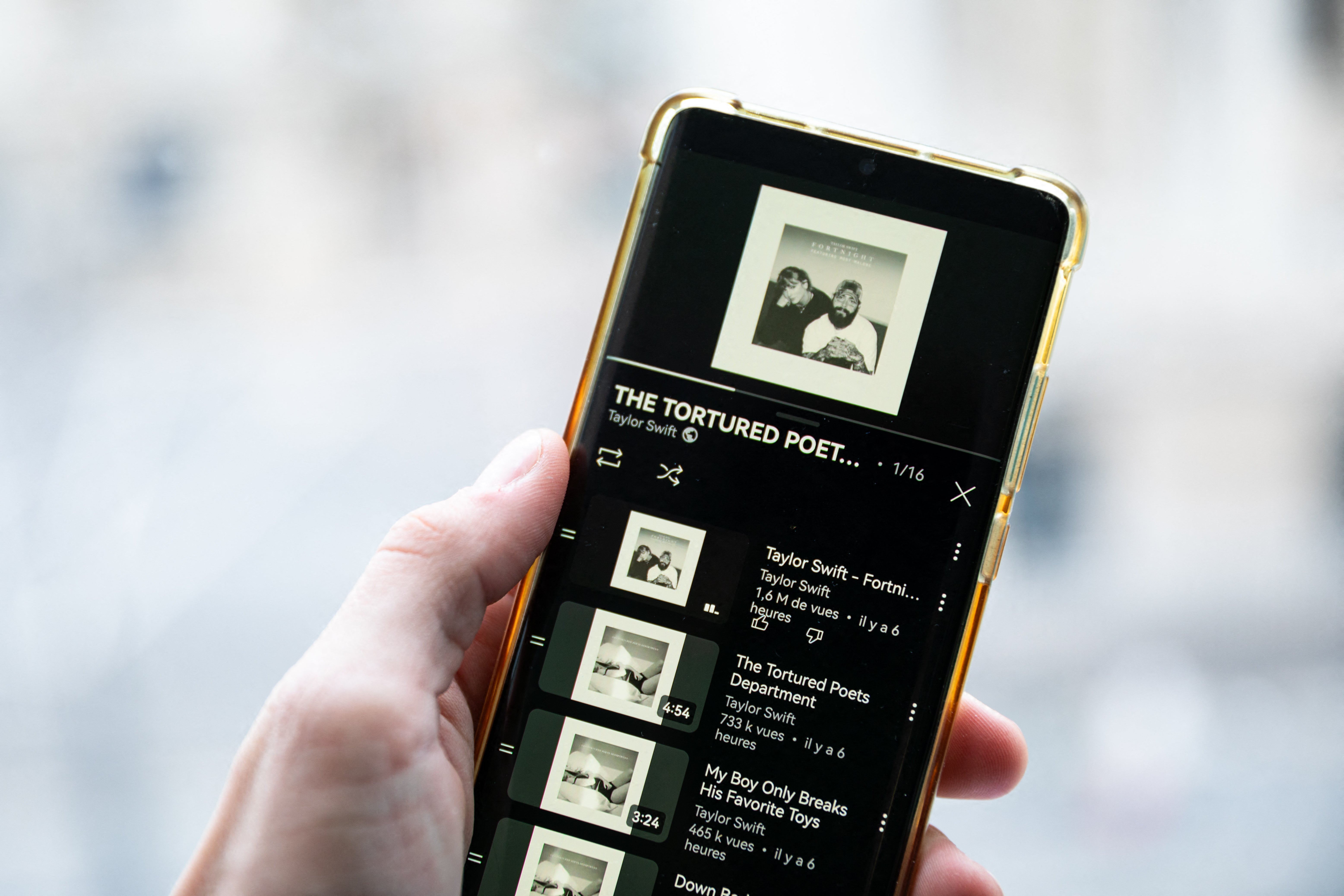 A smartphone displaying Taylor Swift’s new album on Spotify